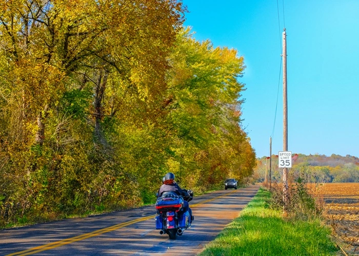 Motorcycle rider traveling along a rural road near Abbeville, South Carolina, highlighting motorcycle accident risks on local highways