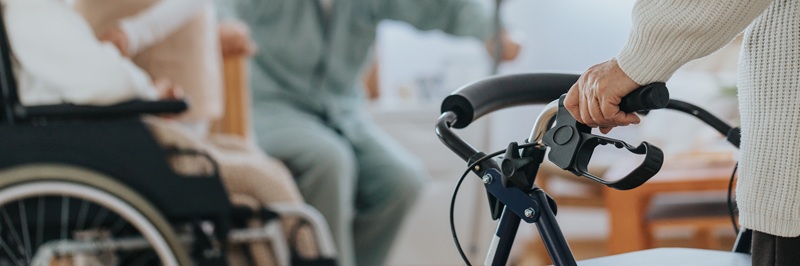 Caregiver helping older disabled people with daily activities